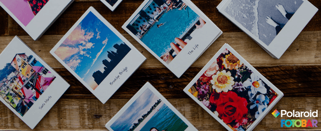 Polaroid photos laid out on a table.